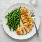 printed recipe card next to finished hellmann's mayonnaise chicken